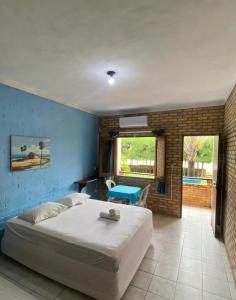 Ένα ή περισσότερα κρεβάτια σε δωμάτιο στο Hotel das Falésias Praia das Fontes