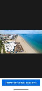 an aerial view of a beach with buildings and the ocean at Lovely place in Perea in Perea