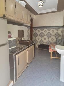 Kuchyň nebo kuchyňský kout v ubytování Atlas Homes
