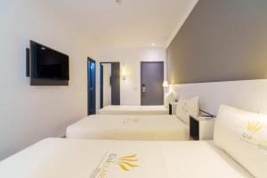 Postel nebo postele na pokoji v ubytování Uniclass Hotel Pinheiros