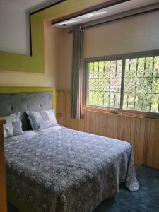 Postel nebo postele na pokoji v ubytování Atlas Homes