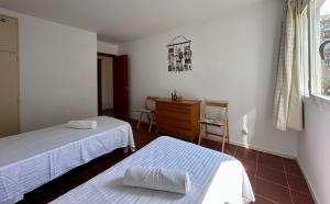 Postel nebo postele na pokoji v ubytování Home Ibiza Salou