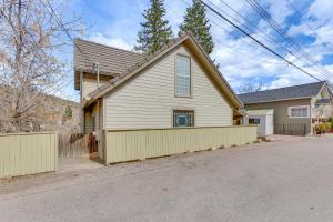 a white house with a fence in front of it at half Mi to Dtwn Manitou Springs Mtn-View Haven! in Manitou Springs