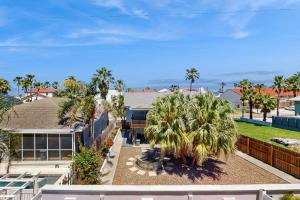 an aerial view of a house with palm trees at Pura Vida Unit A in South Padre Island