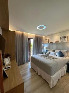 a bedroom with a large bed in a room at Reserva BG - Apto Brisa da Barra - Frente mar in Barra Grande