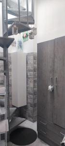 a kitchen with a cupboard and a staircase in a room at grandfather's house in Francavilla Fontana +30 photos