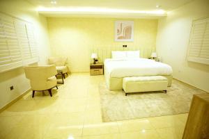 Krevet ili kreveti u jedinici u okviru objekta Tranquil Oasis Hotel