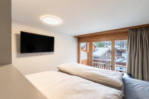 Postel nebo postele na pokoji v ubytování Homebase by Revier