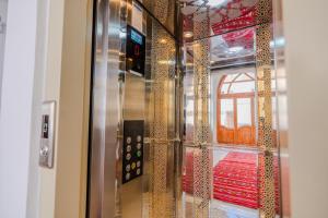 a glass door with a view of a room at Al Bouhaira Abyad Art & Golf in Essaouira +59 photos