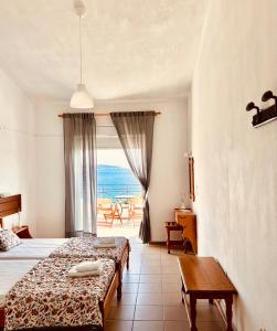 Katil atau katil-katil dalam bilik di Lenio Rooms