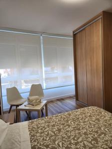A bed or beds in a room at Hospedaje Norte