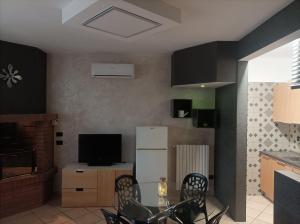 TV a/nebo společenská místnost v ubytování Relais Frantoio delle Pietre