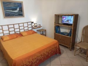 Postel nebo postele na pokoji v ubytování Relais Frantoio delle Pietre