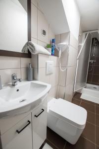 Koupelna v ubytování APARTAMENT U KOMINKÓW ZAKOPANE ŚCISŁE CENTRUM