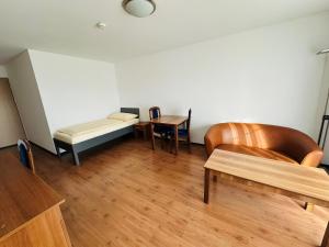 Postel nebo postele na pokoji v ubytování Motel & Aparthotel Brüggli