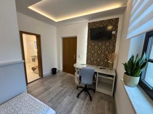 TV a/nebo společenská místnost v ubytování Landgasthof & Hotel Waldeck