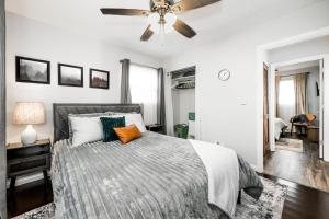 a bedroom with a bed and a ceiling fan at Meadow View BNB in Lima