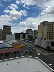 a view of a city with buildings and a street at C&J city centre Airbnb in Windhoek