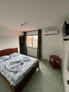 Postel nebo postele na pokoji v ubytování Hotel Mi Ranchito