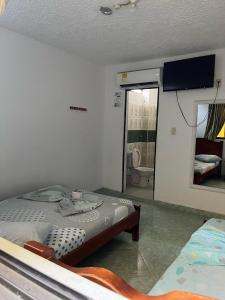 Postel nebo postele na pokoji v ubytování Hotel Mi Ranchito + 2 fotografie