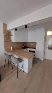 a kitchen with a table and chairs in a room at Apartman Petra in Čapljina