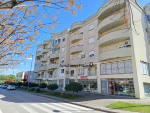 an apartment building on a street with a street at Apartman Petra in Čapljina