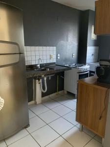 Kuchyň nebo kuchyňský kout v ubytování 3 km da praia de ponta negra + 8 fotografií