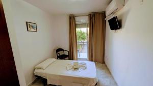 a hospital room with a bed with a bow on it at Hostal Europa in Tarragona