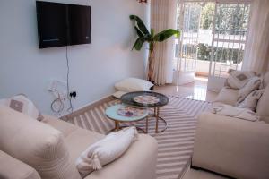 TV a/nebo společenská místnost v ubytování Bellissima Homes