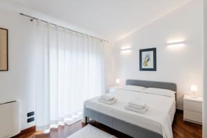A bed or beds in a room at Appartamento MarySol