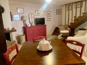 a room with a wooden table with a tea kettle on it at La Casa di Vale in Marano Equo