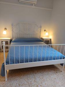 Postel nebo postele na pokoji v ubytování L'Acero Rosso