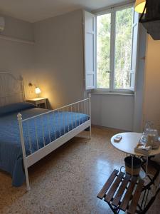 Postel nebo postele na pokoji v ubytování L'Acero Rosso