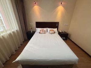 Katil atau katil-katil dalam bilik di 北京金泰之家宾馆有限公司西直门店
