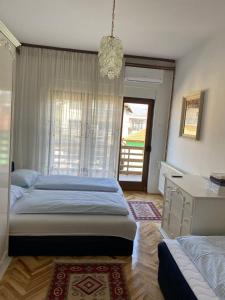 Ένα ή περισσότερα κρεβάτια σε δωμάτιο στο Apartment Alma