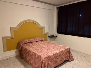Ένα ή περισσότερα κρεβάτια σε δωμάτιο στο Hotel y Restaurant Real Plaza Jacona