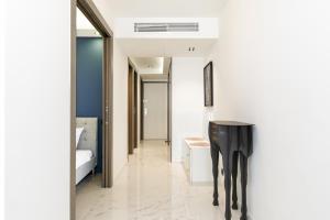 a hallway with a black table in a room at Gray d'Albion 3i7 YourHostHelper in Cannes
