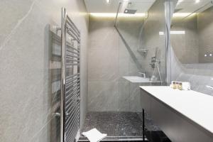 a bathroom with a sink and a shower at Gray d'Albion 3i7 YourHostHelper in Cannes +8 photos