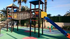 a playground with a slide and a slideintend at PRIMERA LINEA de PLAYA SAN JUAN en ALICANTE in Benimagrell