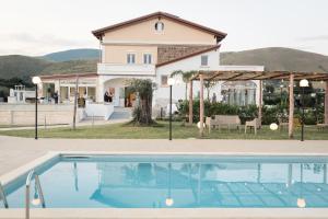 a house with a swimming pool in front of a house at Relais San Giorgio in Pignataro Maggiore