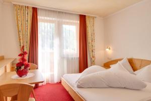 Postel nebo postele na pokoji v ubytování Hotel Theiner