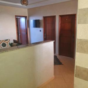 a kitchen with a counter top and two doors at The View in Taghazout