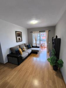 a living room with a couch and a table at BRISAS DEL MAR Eddy,,AIR,WIFI in Candelaria +8 photos