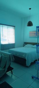 Postel nebo postele na pokoji v ubytování Brasiliano flats