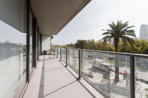 an empty balcony with a view of a city at Located in the Best Area of Las Condes 2BR2BA in Santiago