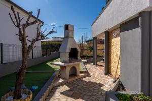 Zahrada ubytování Apartment Floreani