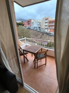 a balcony with a table and chairs and a view at BRISAS DEL MAR Eddy,,AIR,WIFI in Candelaria