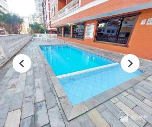 Piscina en o cerca de Apto com 1 dormitorio proximo a praia