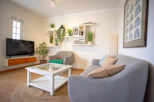 Uma TV ou centro de entretenimento em Villa Lena