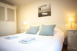 Cama ou camas em um quarto em Villa Lena